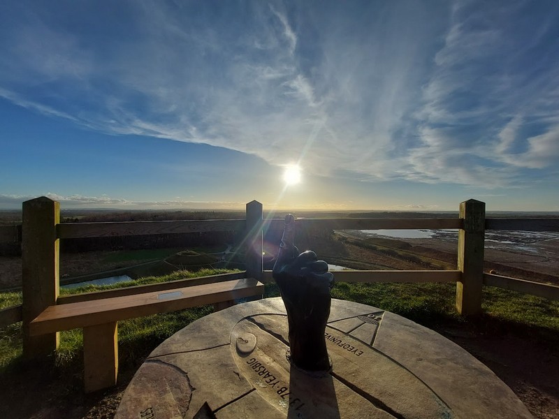 alt="View from top of Northumberlandia with low winter sun"