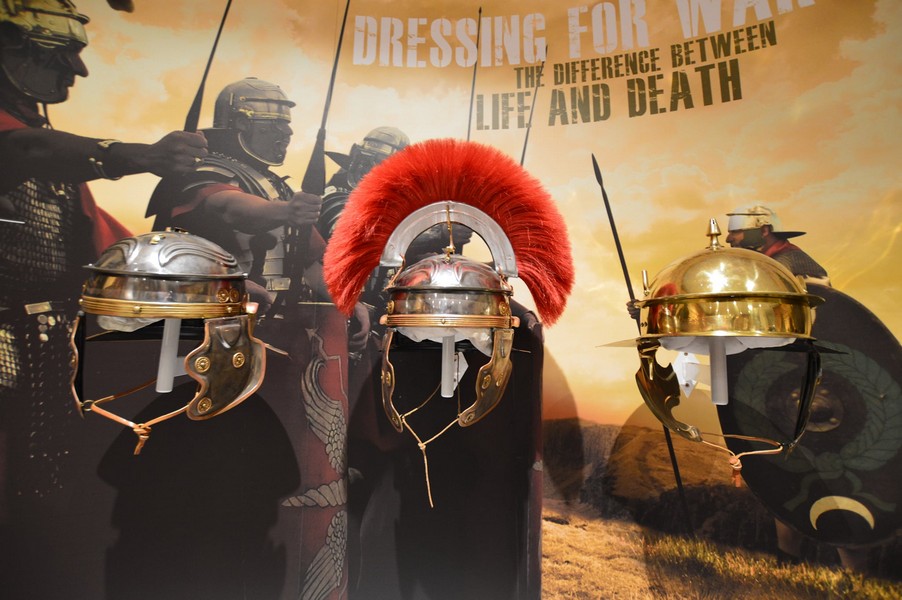 alt="Roman Army Museum display of roman helmets"