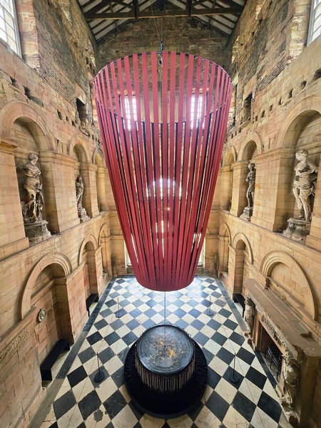 alt="Interior of Seaton Delaval Hall with figurines and ornate floor"